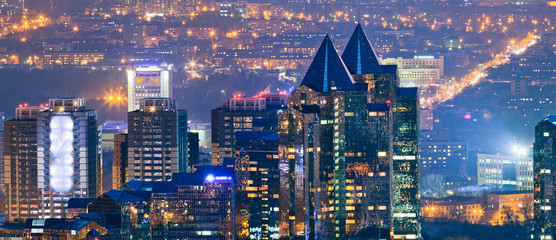 Modern cityscape of Almaty featuring contemporary architecture, bustling streets, and urban charm, highlighting Almaty's modernity and vibrant lifestyle.