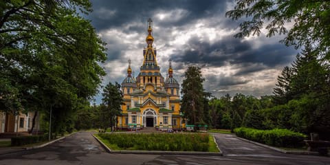 Zenkov Cathedral, a vibrant and intricately designed wooden church in Almaty's Panfilov Park, renowned as one of the tallest wooden structures in the world.