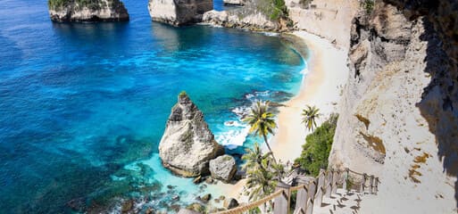 Atuh Beach, located in Nusa Penida, Bali, is a breathtaking hidden gem featuring dramatic cliffs, turquoise waters, and natural arch formations. It's a must-visit spot for adventurers and nature lovers.