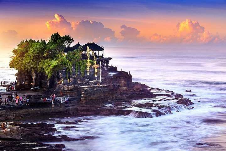 Tanah Lot Temple stunning sunset views and surrounded by indian oceans. Top 5 Must Visit Temples In Bali